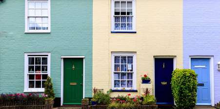 Row of three brightly coloured houses