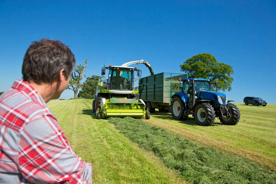 man looking at tractor - farm divorce settlement - farming divorce - farming and divorce
