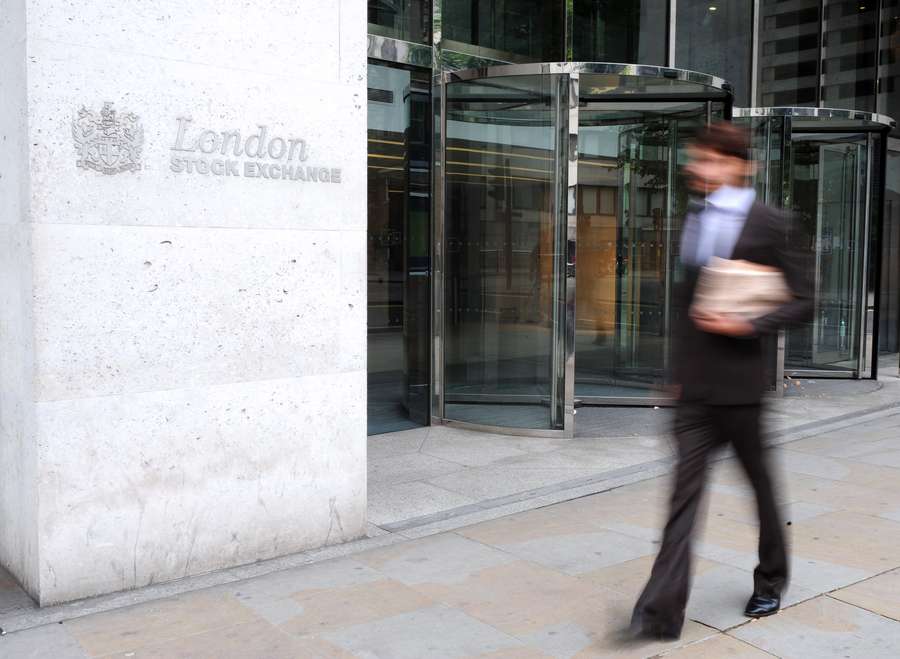 Enterprise Investment Scheme (EIS), Venture Capital Trust (VCT) or shares in Alternative Investment Market (AIM) - A man walking in front of the London Stock Exhange