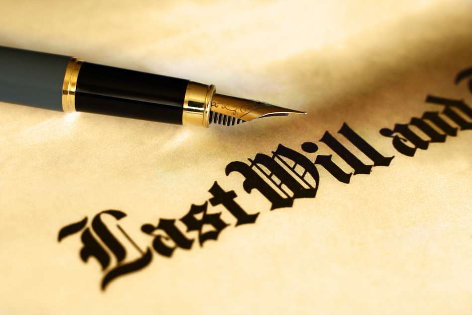 Last will and testament with a pen on top