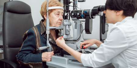 a doctor performing an eye scan