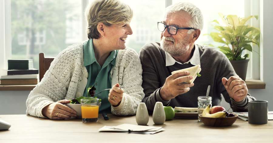 Types of pensions - An older couple enjoying sandwiches together | independent financial advice pensions | Private pension