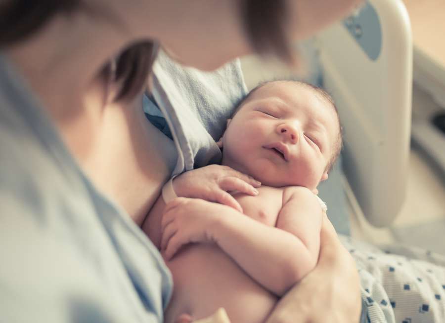 Parent holding New Born child