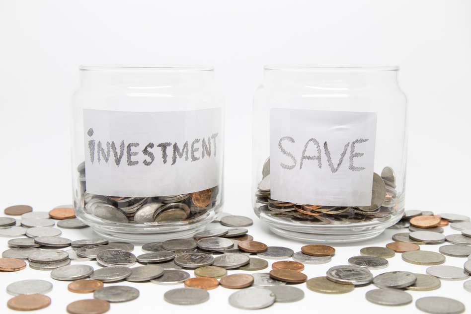 Two glass jars of coins marked : "investment" and "save"-  individual savings account advantages and disadvantages