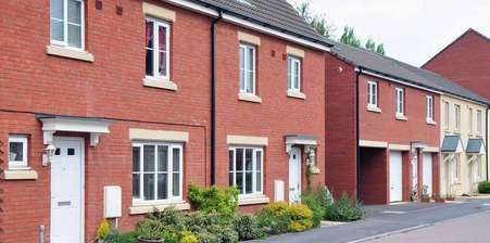 Row of red brick houses - Residential property economic review Feb 24