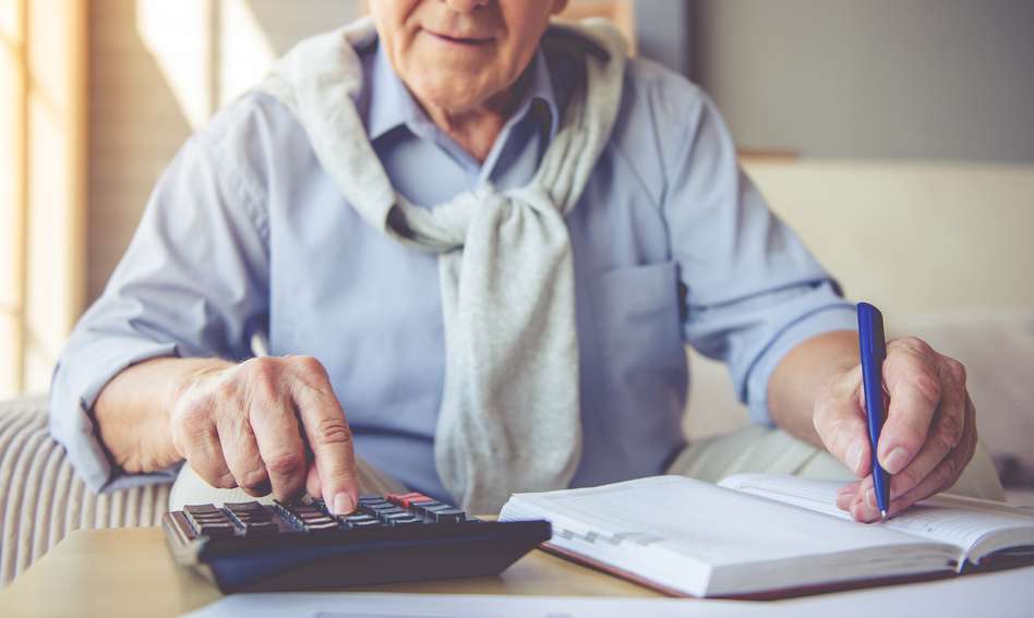 an old man calculating his pension