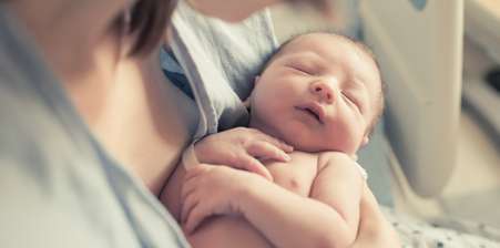 Parent holding New Born child