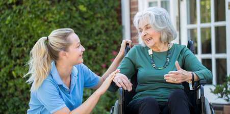 Deed of variation: A carer talking to an elderly woman outside